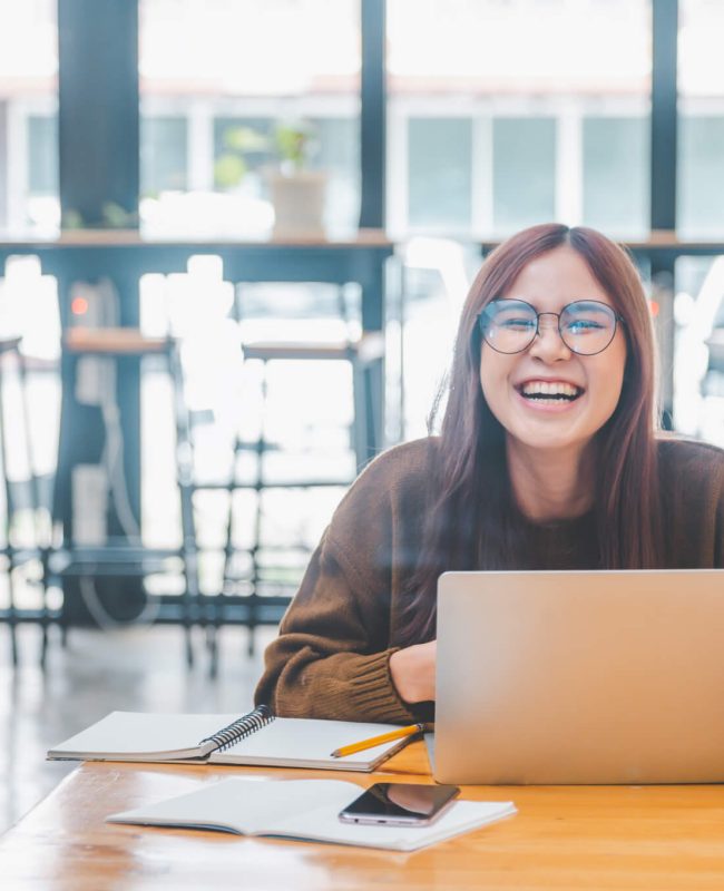 young student wearing headphones studies online distance learning